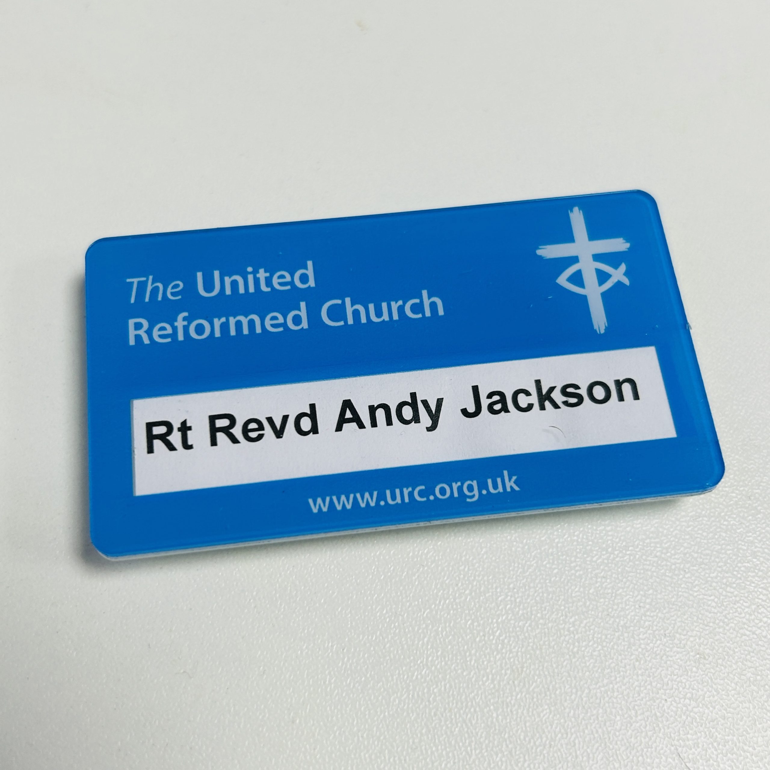 Reusable URC logo name badge, 7.5 cm x 4.5 cm badge